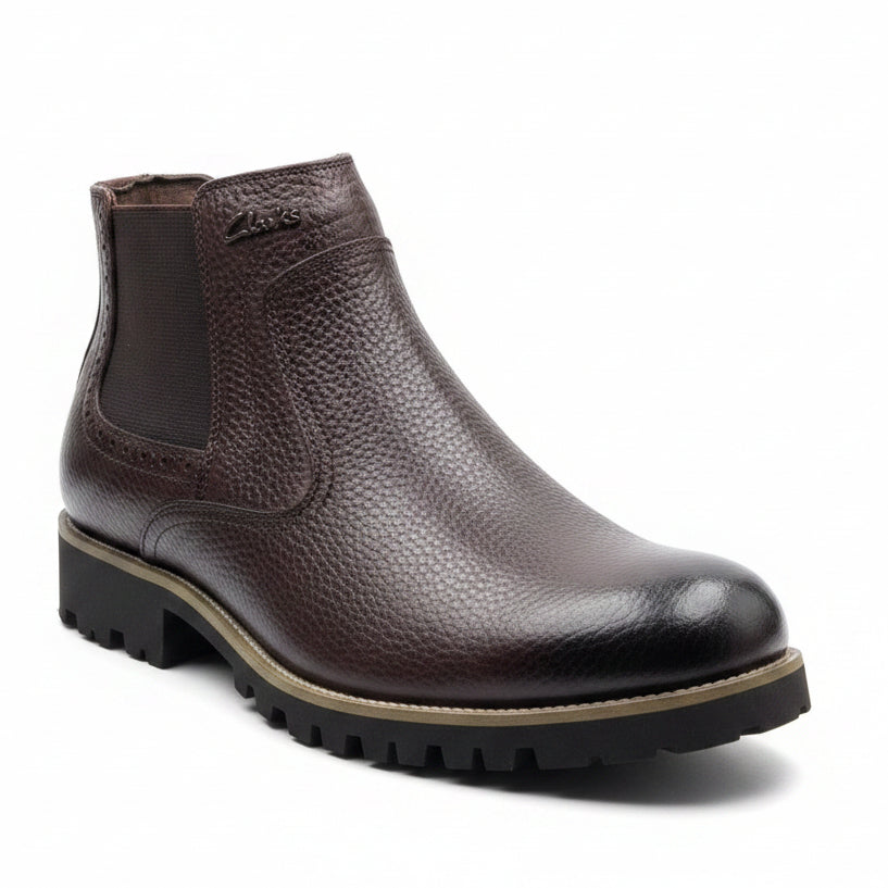Deep espresso brown pebbled leather with tonal elastic panels and rugged outsole