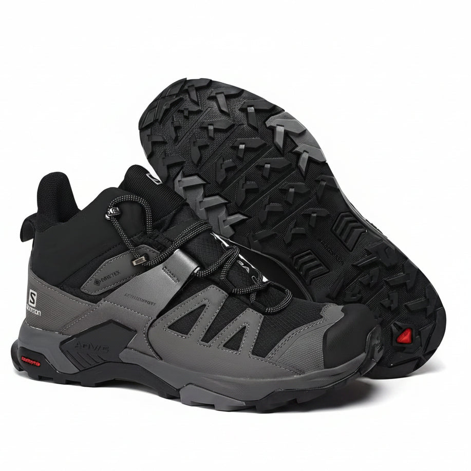 Stealth black performance upper with black trail outsole and rugged outdoor styling