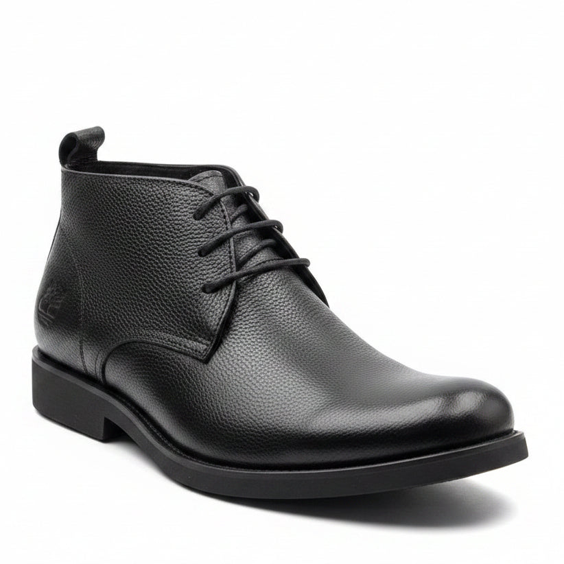 Premium black pebbled leather upper with subtle burnished toe finish and matching outsole